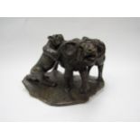 An early 20th Century carved marble sculpture depicting lions attacking a buffalo, 19cm tall, 32cm