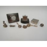 A selection of trinkets including silver timepiece, miniature frame, seal, napkin clips, box etc (9)