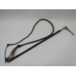 A vintage carriage whip, leather shaft with silver collar and horn top, knotted leather thong