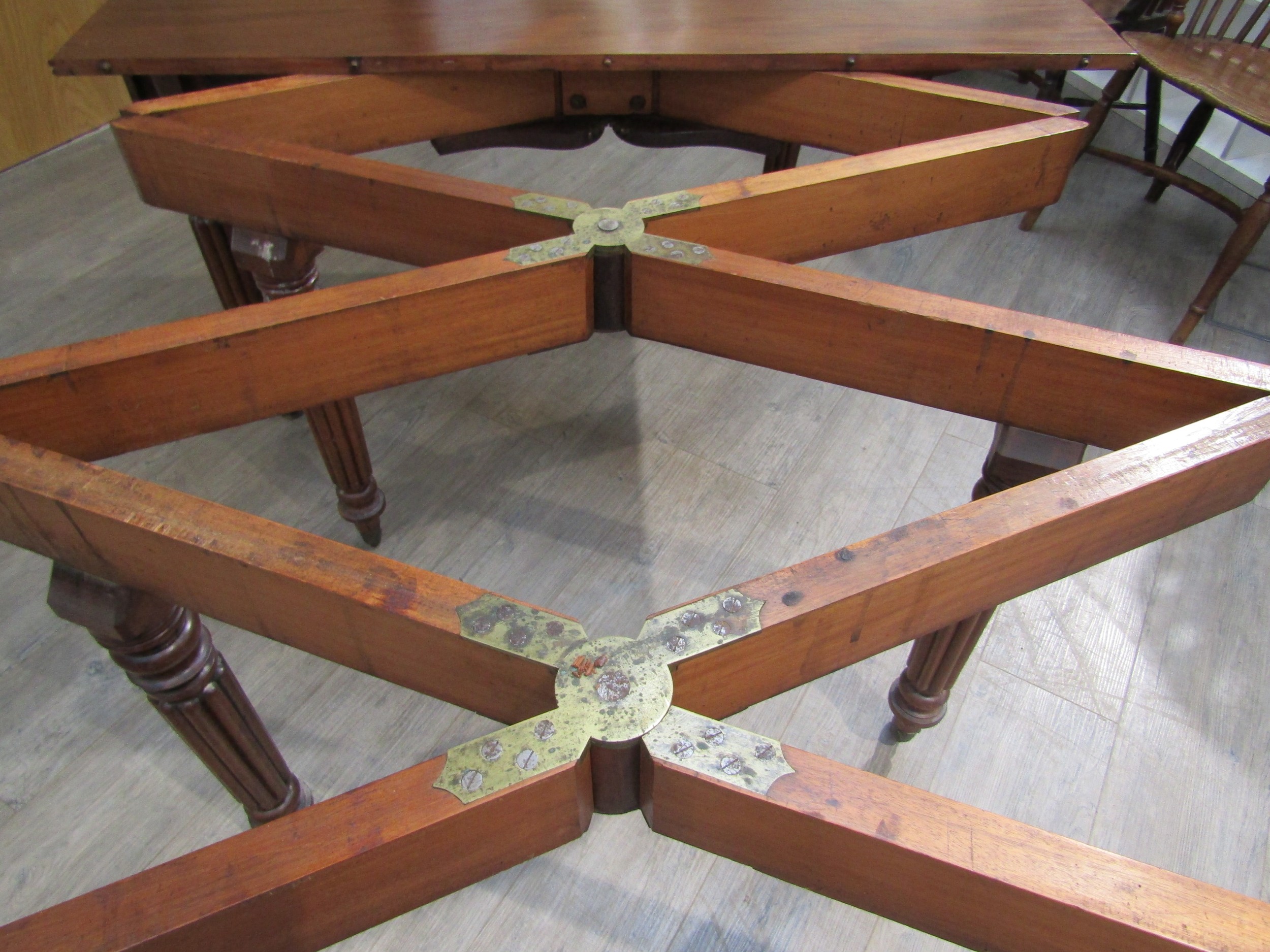 A Georgian mahogany concertina action extending dining table of rounded square form raised upon - Image 7 of 7