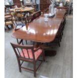 A high quality Regency style triple pedestal dining table with claw castor feet and two extra