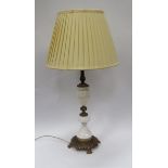 A white onyx and ornate gilt metal table lamp, with shade, 86cm tall