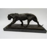 A bronze of a stalking panther on marble plinth, signed Bugatti, 52cm long
