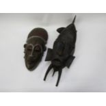 Two African masks, one wood, one pottery, 49cm & 34cm long