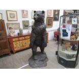 A large bronze figure of a grizzly bear standing on hind legs, 197cm tall approx