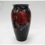 A William Moorcroft pomegranate vase, 25cm tall