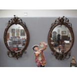 A pair of 19th Century highly ornate girandole mirrors damage present, 93cm x 56cm