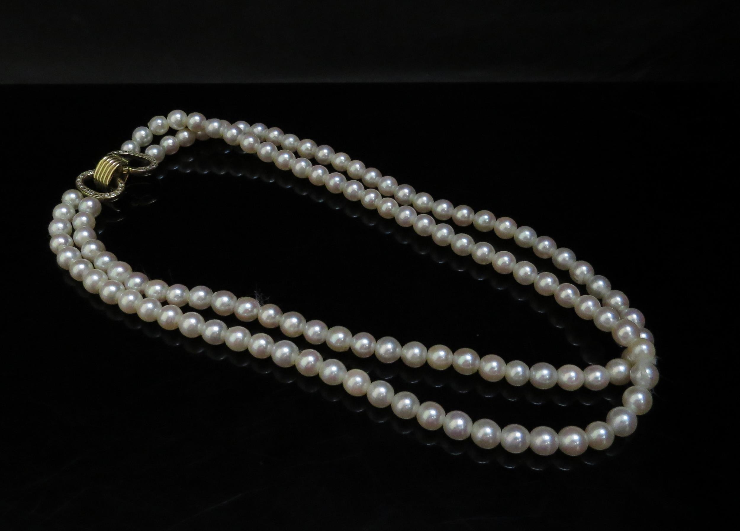 A double stranded pearl necklace 19cm long, diamond encrusted clasp, 42cm long - Image 2 of 3