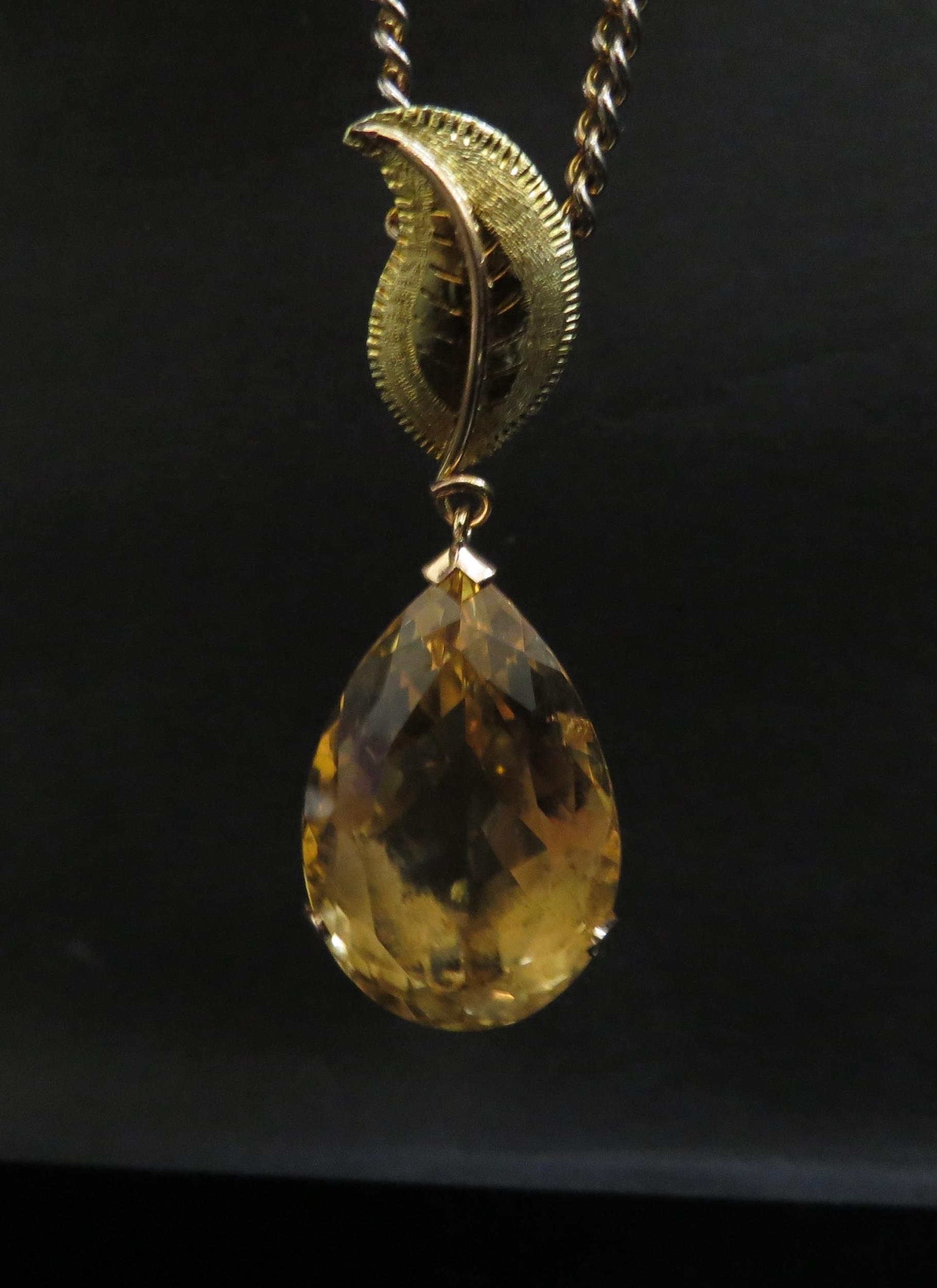 A large pear shaped citrine pendant, 4cm long in 14ct gold mount with later applied 18ct gold leaf - Image 4 of 4
