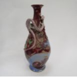 A Royal Doulton Mark V Marshall vase decorated with a pink dragon in high relief on a pink/blue