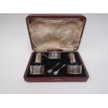 An associated five piece cruet set, makers marks for Deakin and Francis Ltd and B&Co