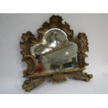 An 18th Century gilded German mirror frame with acanthus and scroll detail with later glass.