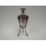 A Berthold Muller silver classical form urn vase with Ram and Swag detail, raised on three legs.