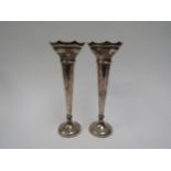 A pair of Sanders and Mackenzie silver trumpet vases with weighted bases, Birmingham 1958, 23cm