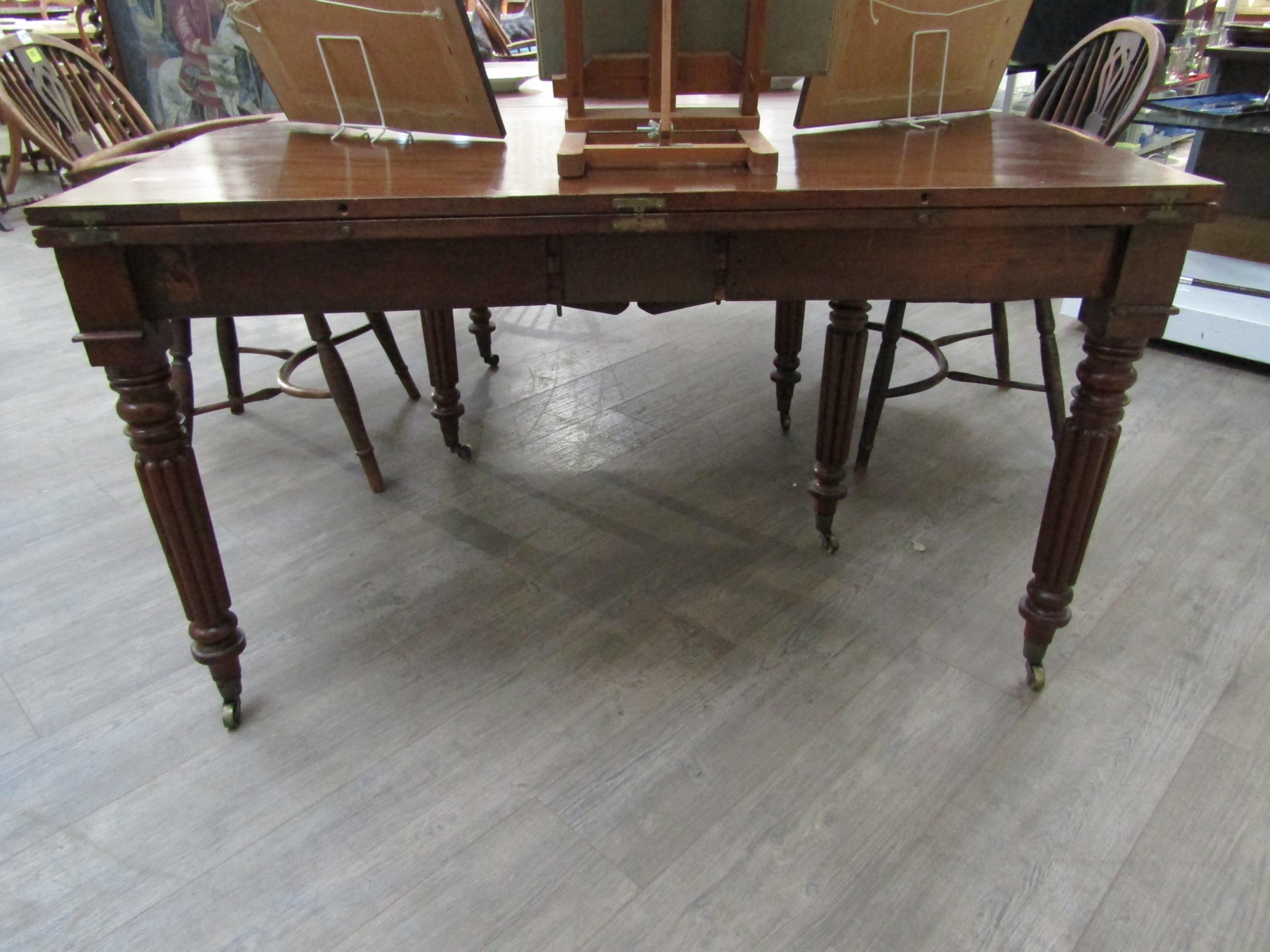 A Georgian mahogany concertina action extending dining table of rounded square form raised upon - Image 2 of 7