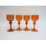 Four Murano sherry glasses c1960's in orange glass, each with aventurine foil inclusions. 12.5cm