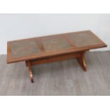 A G-Plan hardwood coffee table with inset beaten copper panel top, 131.5cm x 52cm x 46cm high