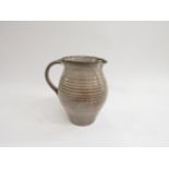 DAVID LEACH (1911-2005): A Studio Pottery jug in speckled brown glazes. Impressed seal, 17cm high
