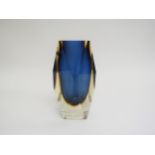 A Murano Sommerso style facet cut vase in blue and amber, encased in clear. 15.5cm high (fleabite to