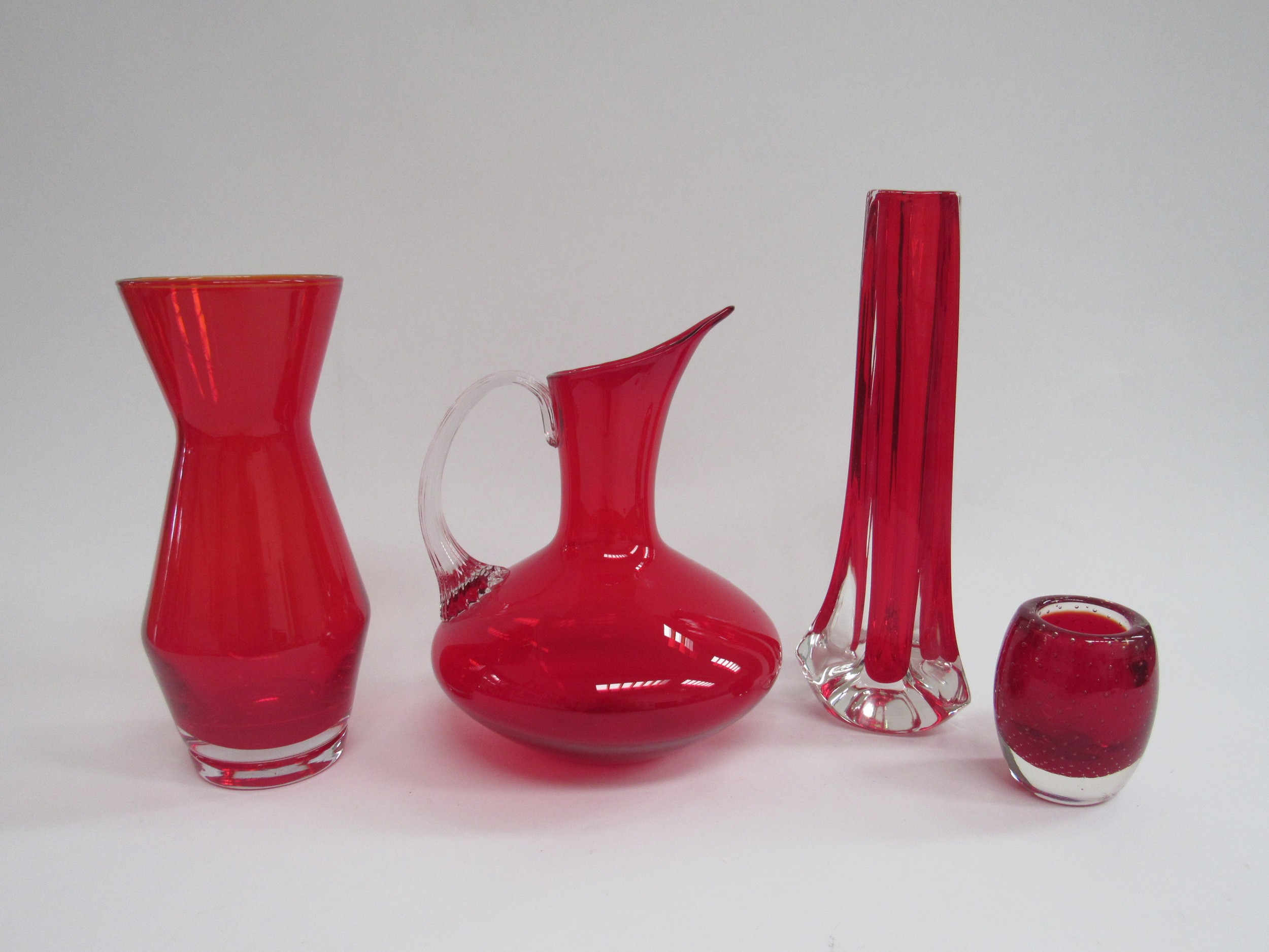 A Whitefriars red cased glass vase, a small ruby red Whitefriars cased glass vase by Geoffrey