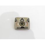 A 1980's Mexican sterling silver brooch with Aztec inlaid design. Marks to the reverse.