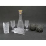 A collection of Whitefriars drinking glasses and decanter in Icicle and bark textures in clear and
