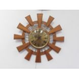 A sunburst wood and metal wall clock, 41.5cm diameter