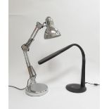 An Ottlite modernist design desk lamp in black and a contemporary chrome angle poise lamp (