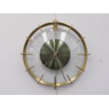 A 'Jaz' brass and curved glass wall clock, 33cm diameter