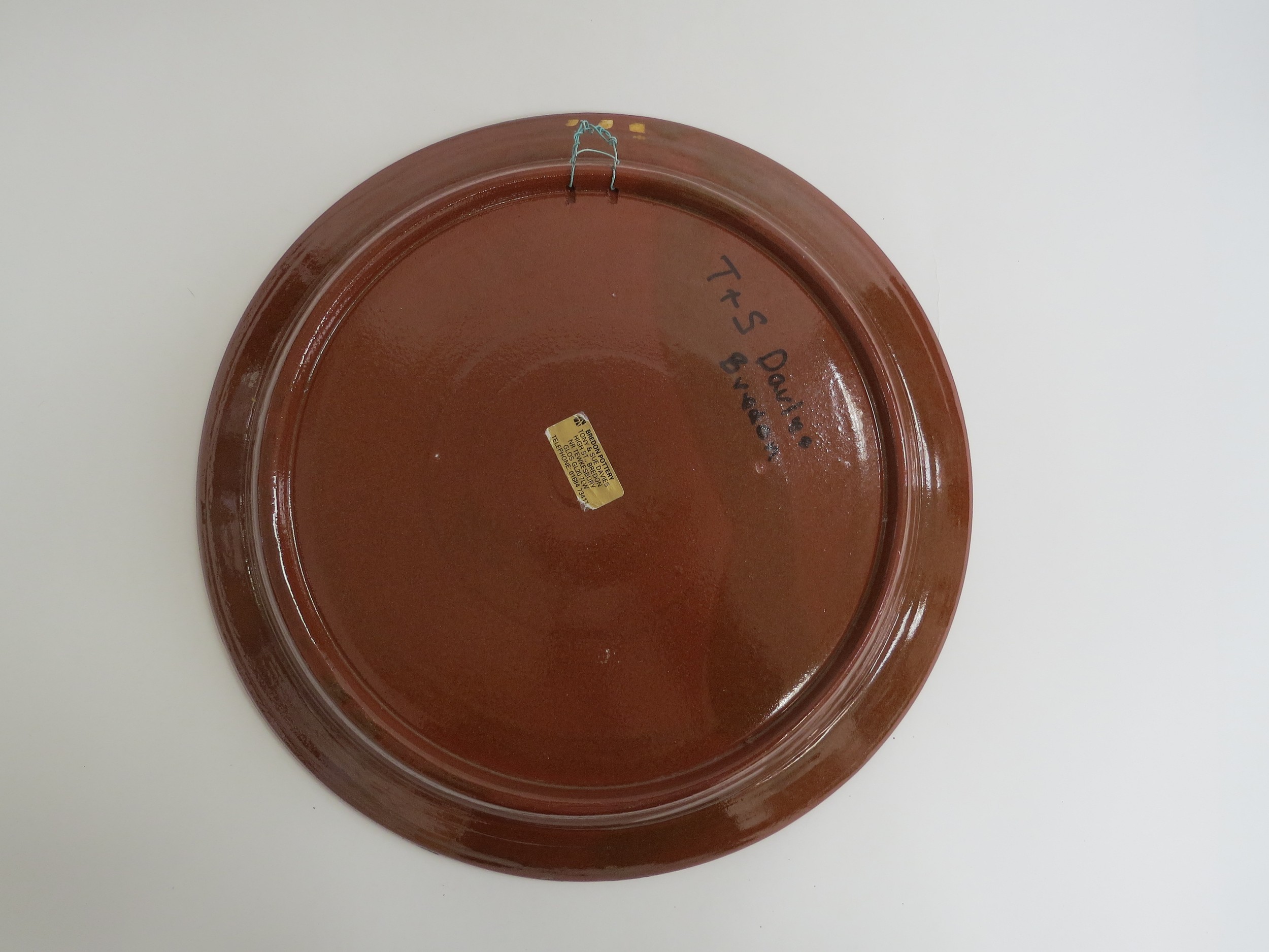 A Bredon Pottery slipware charger by Tony & Sue Davies, 'Life Is Just A Bowl Of Cherries'. Label - Image 2 of 2