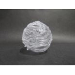 An art glass random strap caged ball in clear glass, unmarked. 14cm high