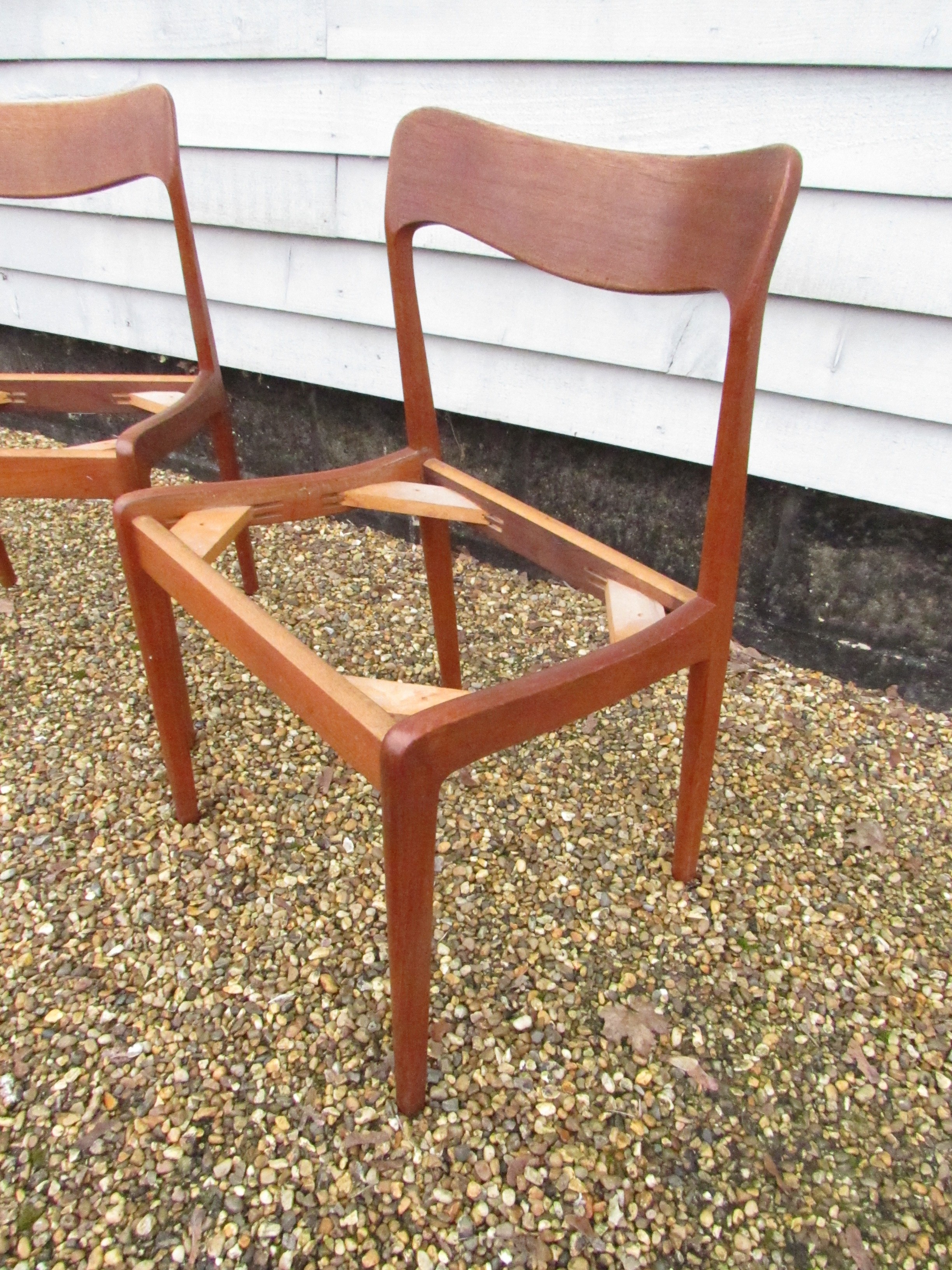 A pair of Danish teak dining chairs, seat pads removed as do not conform with current Fire Safety - Image 2 of 4