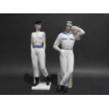A pair of Spanish porcelain figures by Miquel Requenna, male with rainbow hair, glasses and a Ghetto