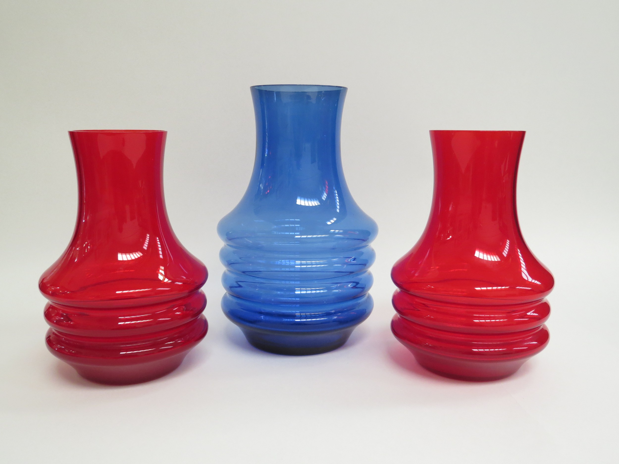 Three Riihimaki Finnish glass vases, each with hooped mid section body, largest in blue and a pair