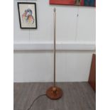 An Anodised metal standard lamp on a turned wooden base with ball feature to column. Overall