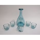 An Ole Winter Holmegaard glass carafe and five glasses in pale blue, decanter 23cm high