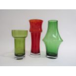A Finnish red glass vase by Tamara Aladin, model 1373 and two other vases in green. Tallest 25cm