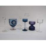 A pair of Sandringham Wedgwood candlesticks, three Brancaster candlesticks (1 blue/clear), Purple