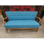 A 1940's Danish three seater sofa with original turquoise upholstery, stained beech arms, base and
