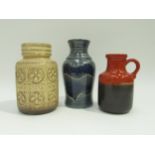 Three West German Pottery vases in cream, blue and burnt orange glazes. No.414-16, 289-18, 630-20.