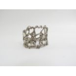 A 1960's white metal abstract statement cuff bangle