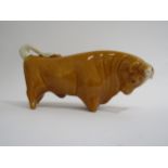 A Trentham bull designed by Colin Melbourne finished in unusual honey colour. 29cm long x 15cm high