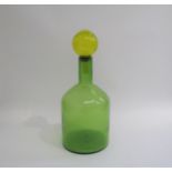 A Dutch Polspotton Glass bottle vase in green with a yellow glass stopper. 42cm high