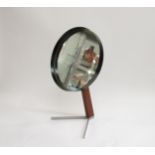 A Durlston dressing table mirror on teak and steel stand, black metal mirror casing, 40cm high