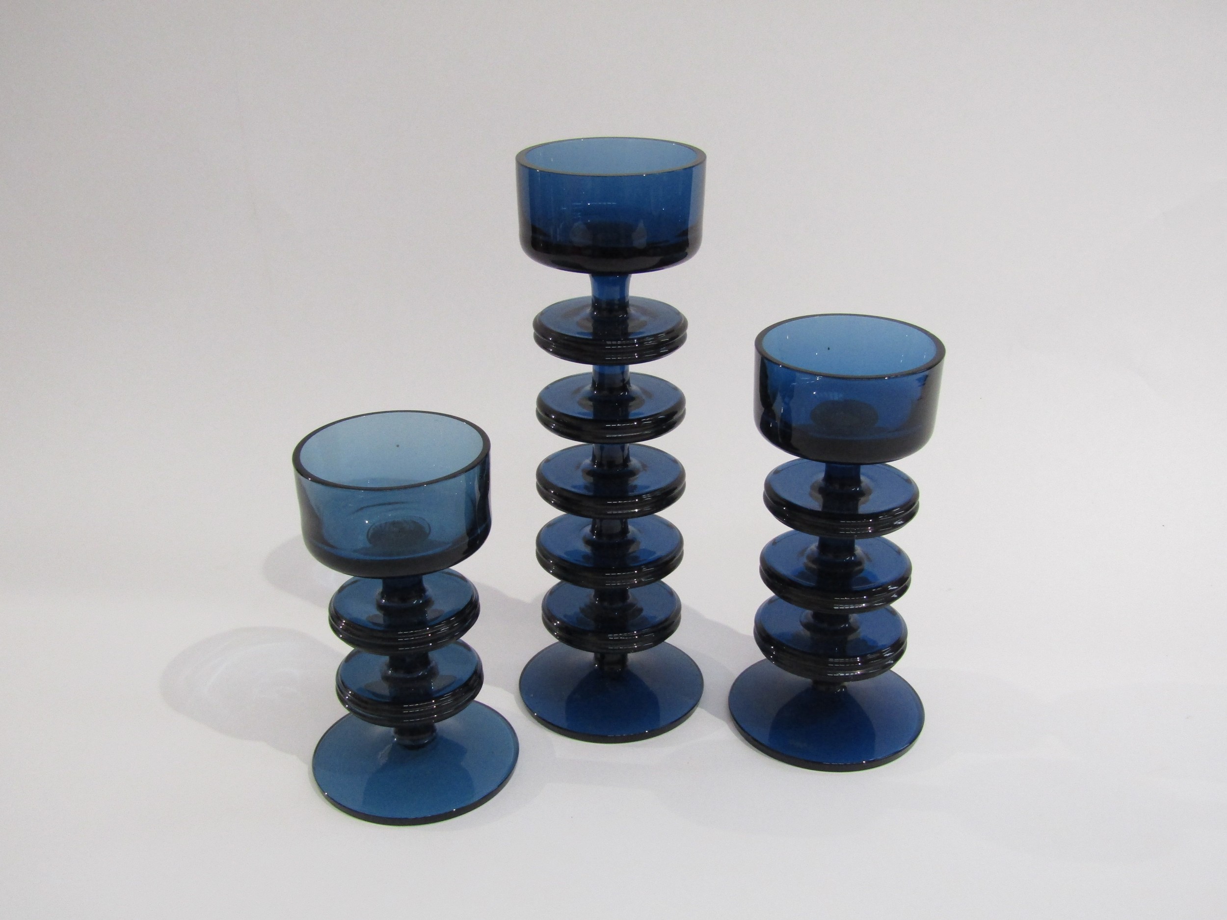 Three Sheringham candleholders in blue glass 1 x 5 ring, 1 x 3 ring and 1 x 2 ring, designed by