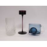 A Wedgwood Glass amethyst Brancaster candle holder, a 'Flame' range glass and a blue mug, all