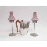 Two Old Hall stainless steel candle holders designed by Robert Welch with glass shades and a Picquet