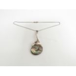 A sterling silver modernist mid century pendant with aberlone shell decoration, marked 925