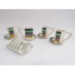 David Pantling - A studio pottery set of four cups and saucers from the Pi range and a similar toast