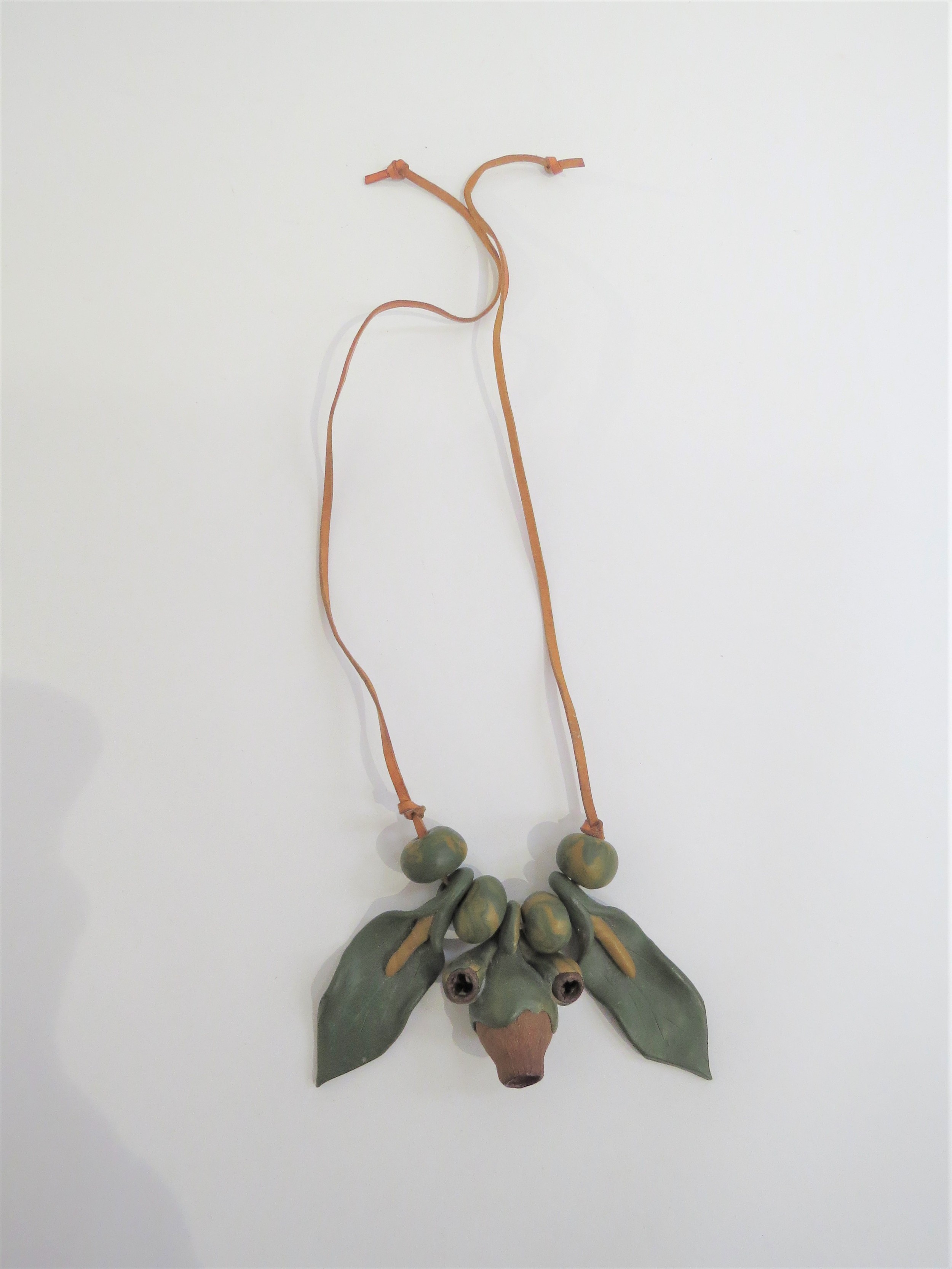 A 1970's seed pod and clay organic necklace on leather thong. - Image 2 of 2